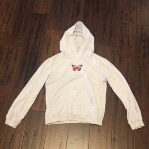 Girls light grey hoodie with a 🦋 on it. Girls size 10.